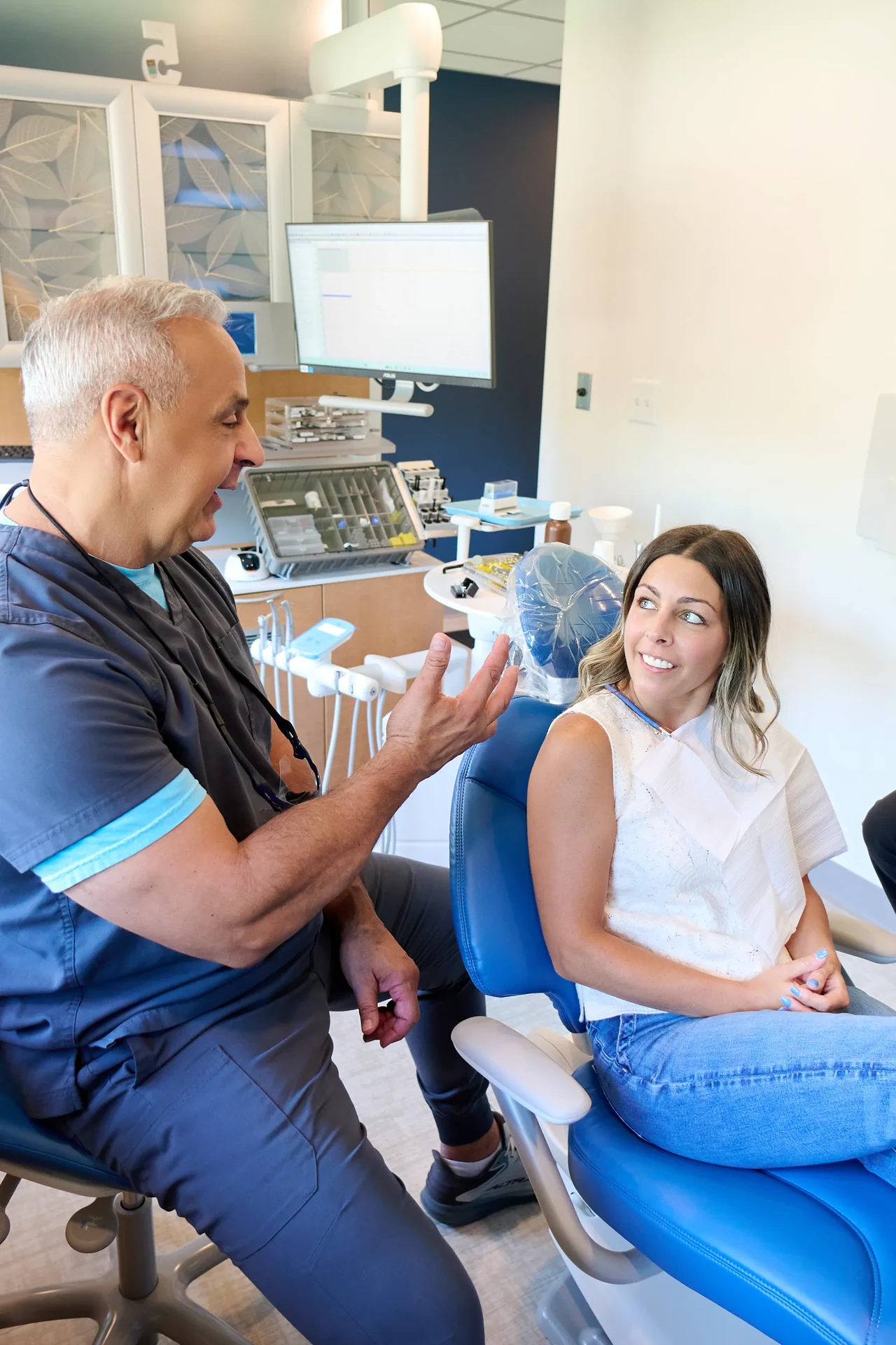Dr. Mecca reviewing treatment options with a patient