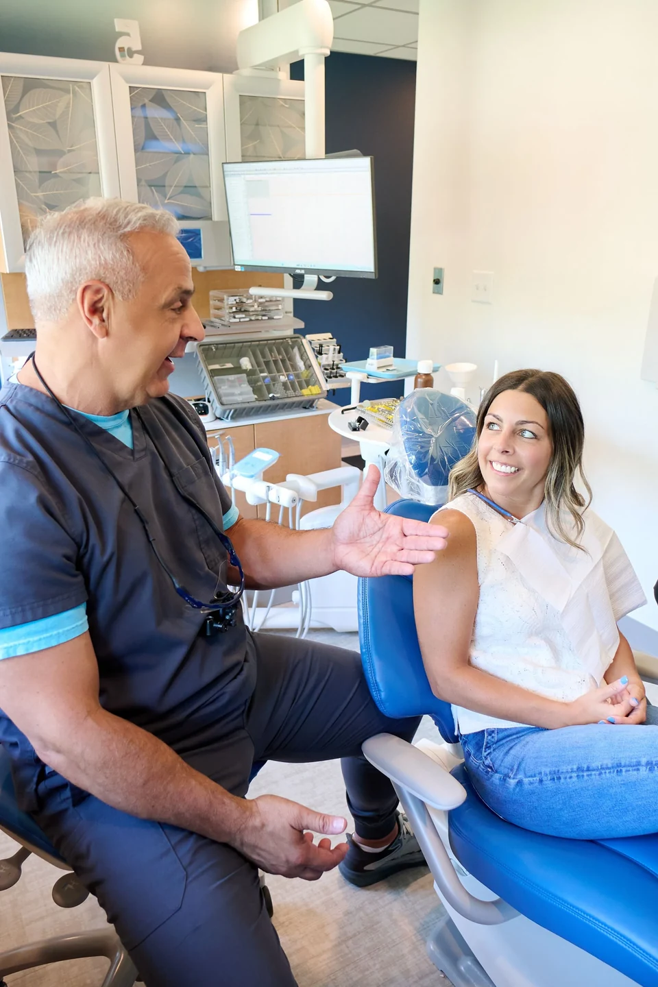 Dr. Mecca consulting with a patient about cosmetic dentistry options