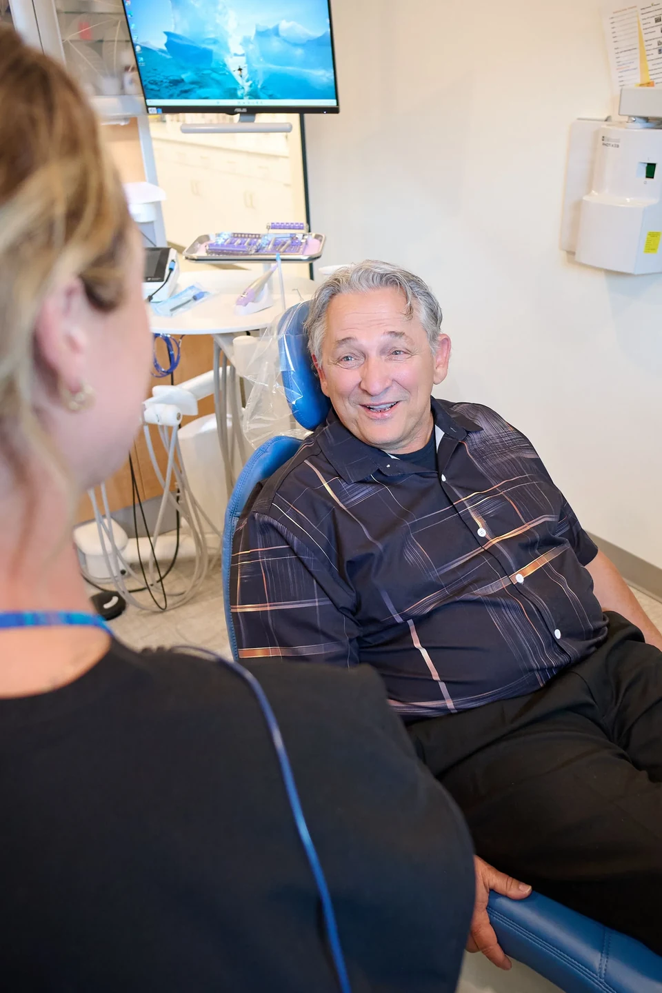 Smiling patient in the dental chair at Mecca Dental